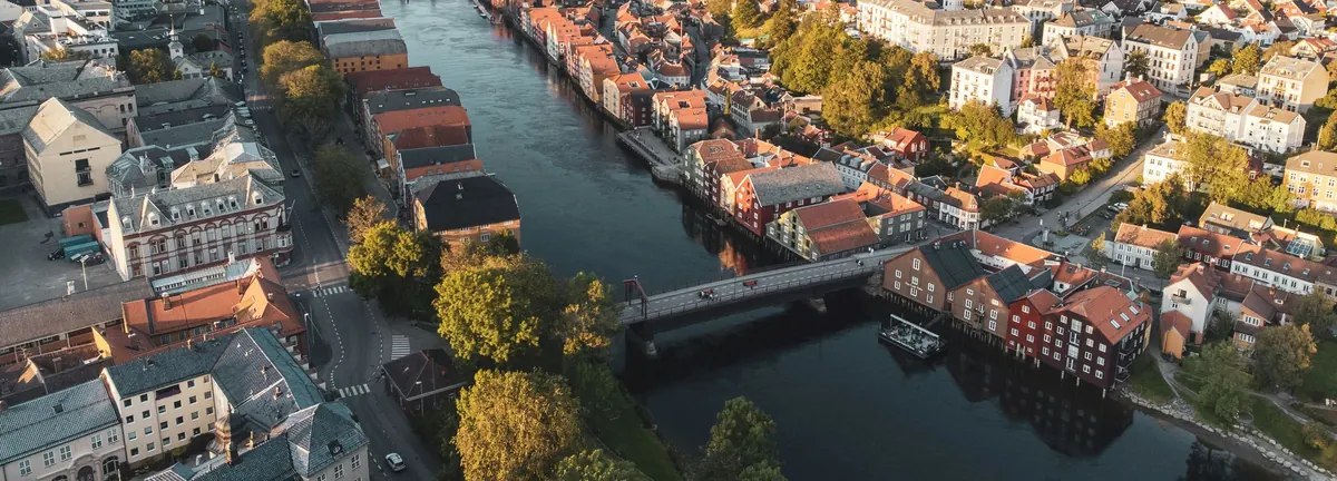 Aerial photo of Trondheim with the Nidelva river, the Old Town Bridge and the wharves